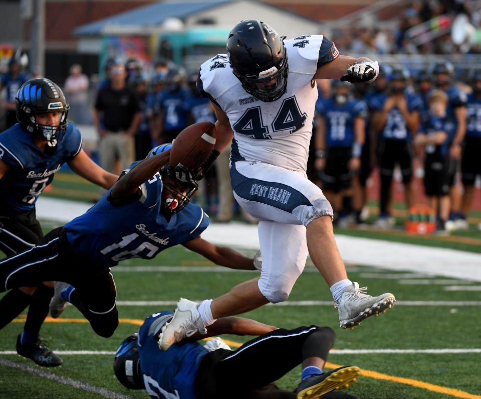 Kent Island's Kasey Heath (44) jumps for a touchdown against Decatur Friday, Sept. 17, 2022, in Berlin, Maryland. The Buccaneers defeated the Seahawks 31-14.