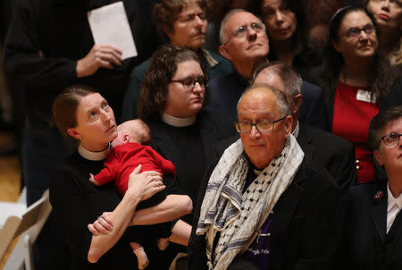 Mourners attend a memorial service at the Sailors and Soldiers Memorial Hall of the University of Pittsburgh, a day after 11 worshippers were shot dead at a synagogue in Pittsburgh, Pennsylvania, U.S., October 28, 2018. REUTERS/Cathal McNaughton