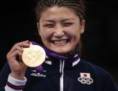 Japan's Kaori Icho poses with her gold medal at the podium of the Women's 63Kg Greco-Roman wrestling at the ExCel venue during the London 2012 Olympic Games August 8, 2012. REUTERS/Damir Sagolj