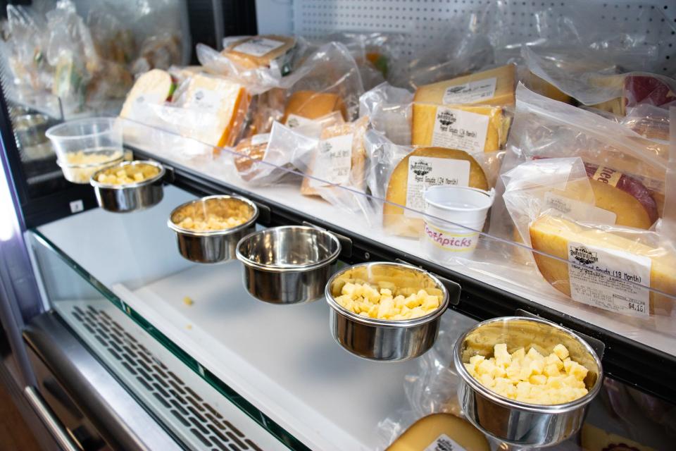 Bowls of tasting cheese in a refrigerated area