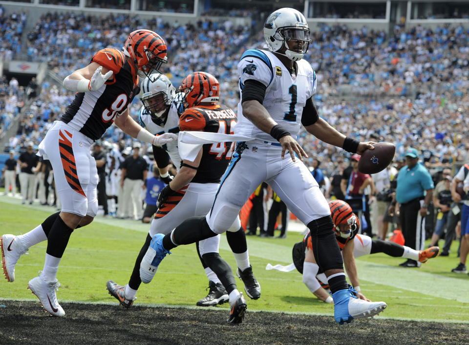 Carolina Panthers' Cam Newton (1) runs for a touchdown against the Cincinnati Bengals during the first half of an NFL football game in Charlotte, N.C., Sunday, Sept. 23, 2018. (AP Photo/Mike McCarn)