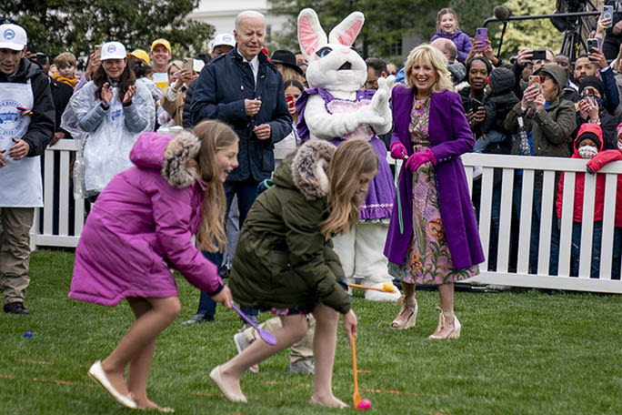 President Joe Biden and First Lady Jill Biden watch a race during the White House Easter Egg Roll at the White House, on April 18, 2022. - Credit: AP