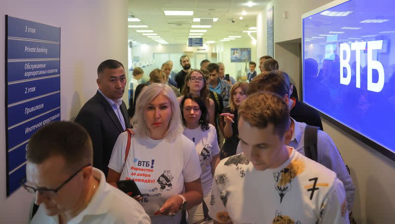 Clients of the Russian bank VTB gather at its head office in Moscow