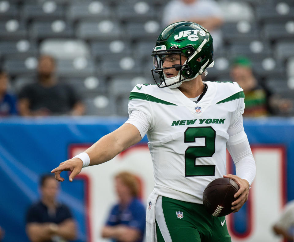 Jets white uniforms with green lettering and helmet