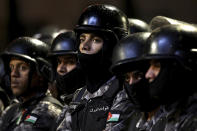 <p>Jordanian gendarmes and Jordanian security forces stand alert in the capital of Amman, early Wednesday, June 6, 2018. Jordan’s King Abdullah II on Tuesday appointed a new prime minister, the royal palace said, naming a leading reformer as head of government in hopes of quelling the largest anti-government protests in recent years. (Photo: Raad al-Adayleh/AP) </p>