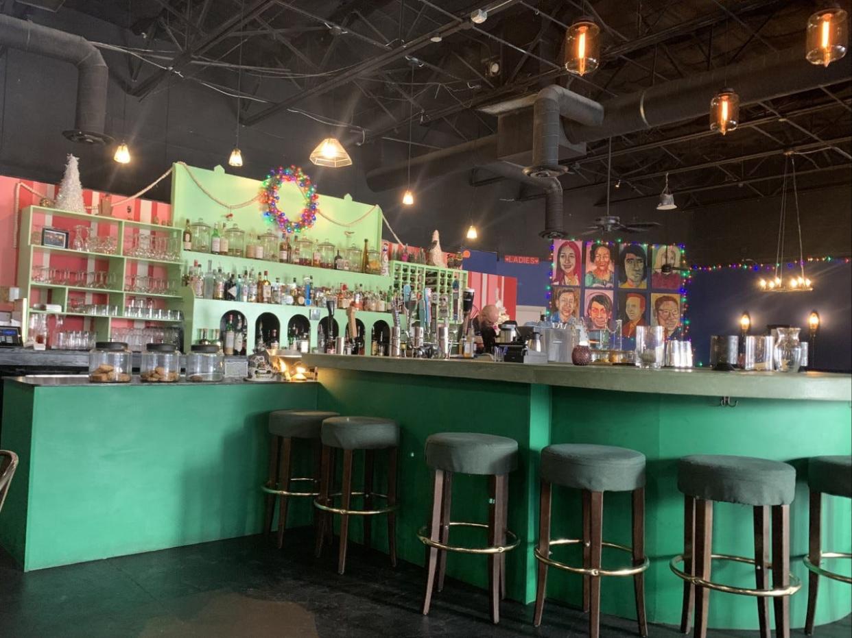 The focal point of the new Eloise restaurant is a green and pink bar with stools. The restaurant moved to its new location at 126 Shadow Mountain in October.