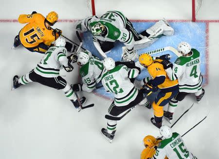 Apr 20, 2019; Nashville, TN, USA; Dallas Stars defenseman Roman Polak (45) defends shots from Nashville Predators right wing Craig Smith (15) on Dallas Stars goaltender Ben Bishop (30) during the third period in game five of the first round of the 2019 Stanley Cup Playoffs at Bridgestone Arena. Mandatory Credit: Christopher Hanewinckel-USA TODAY Sports