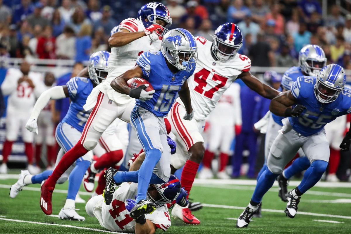 Detroit Lions cornerback Khalil Dorsey (30) tackles New York