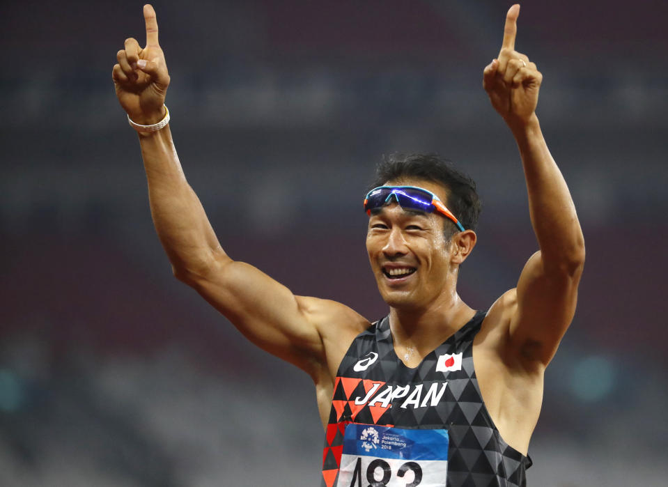 Japan's Keisuke Ushiro celebrates after winning the decathlon gold during the athletics competition at the 18th Asian Games in Jakarta, Indonesia, Sunday, Aug. 26, 2018. (AP Photo/Bernat Armangue)