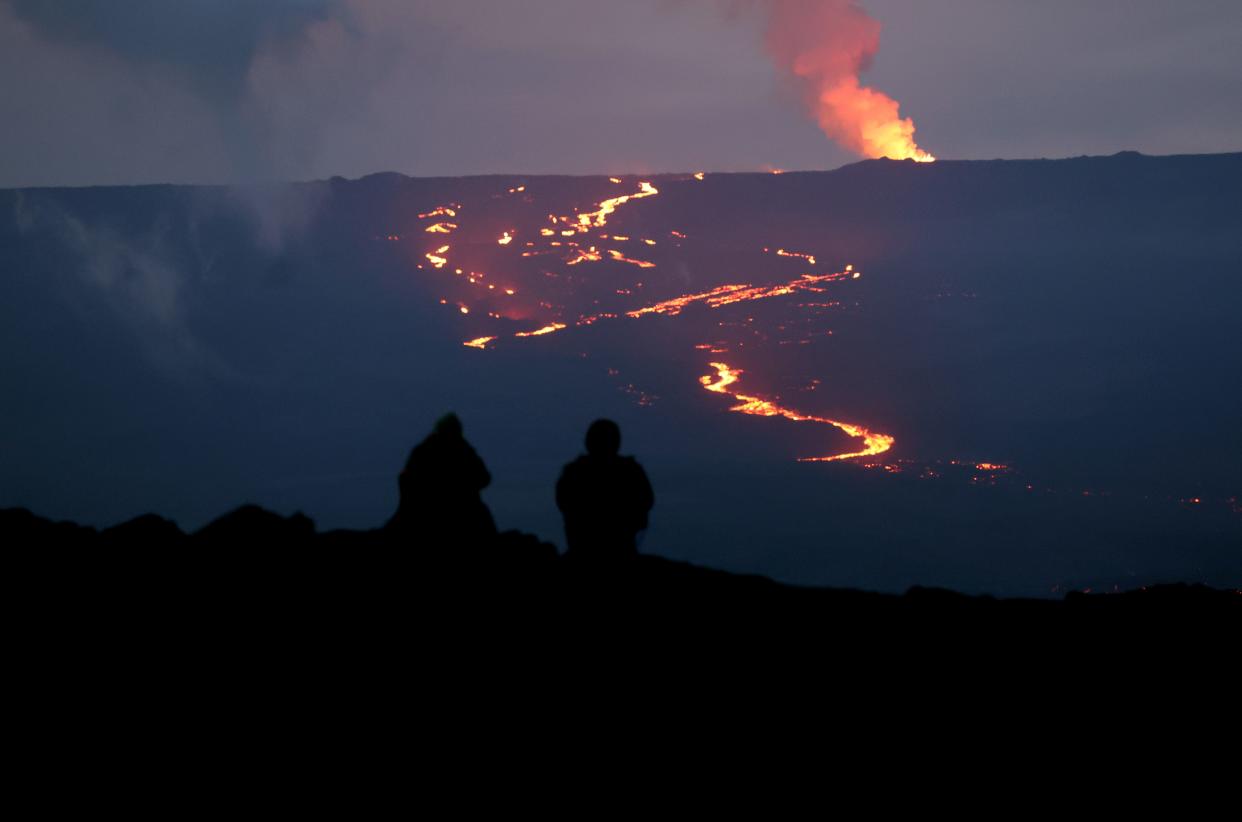 The eruption of the Mauna Loa volcano near Hilo, Hawaii, on Dec.