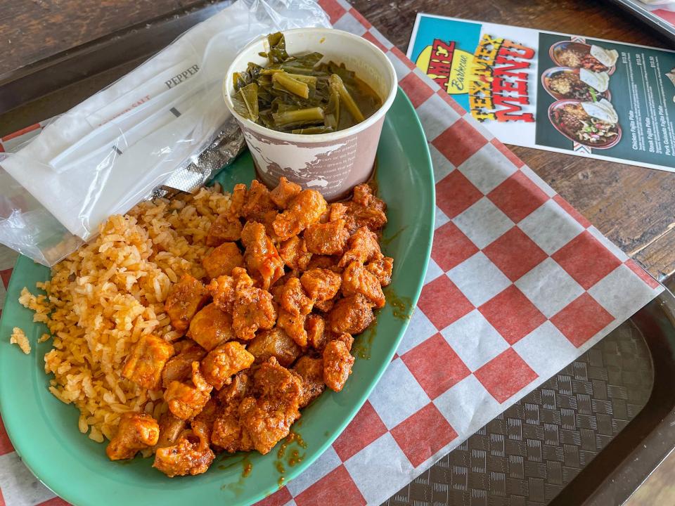 Tamez BBQ's pork guisado plate with tortillas, rice and collard greens in Athens, Ga. on Friday, Aug. 25, 2023.