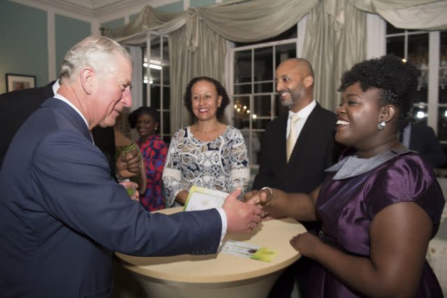 Charles meets rescue volunteers during a visit to the reception at Government House in Antigua