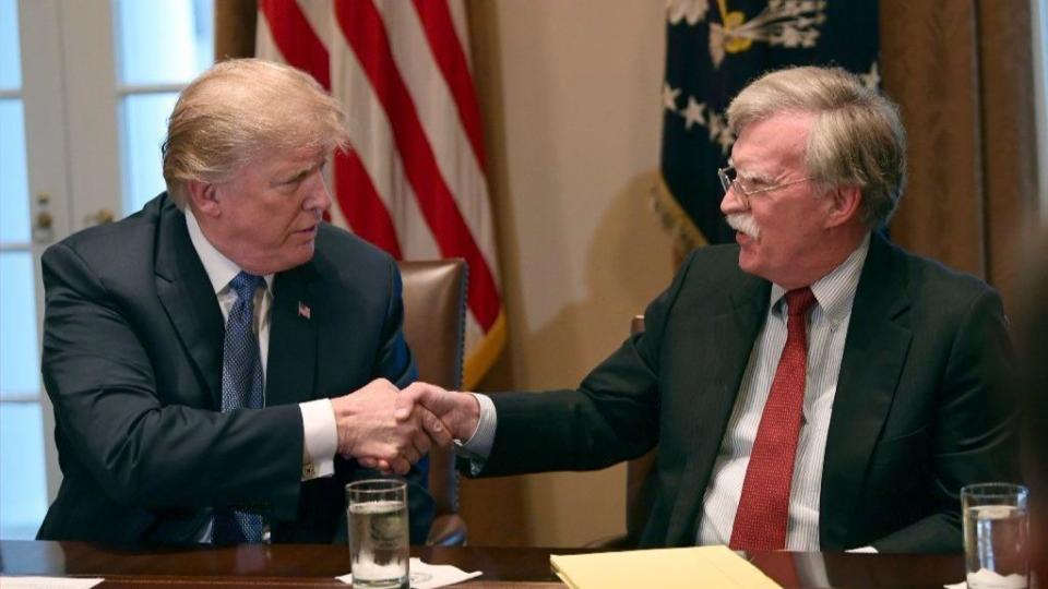 John Bolton at right with his former boss and current legal adversary, Donald Trump.