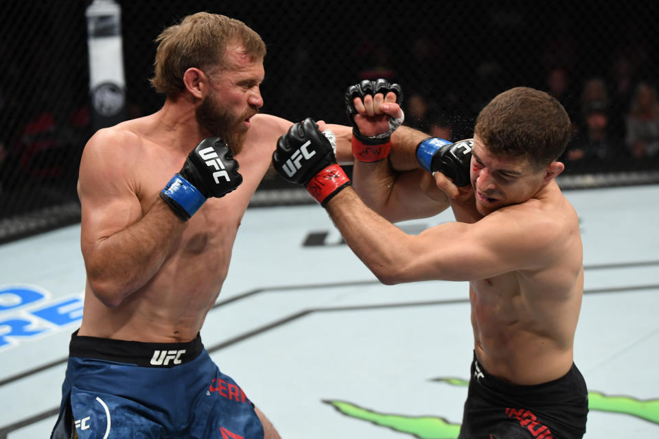 Donald Cerrone punches Al Iaquinta in their lightweight bout during the UFC Fight Night event at Canadian Tire Centre on May 4, 2019 in Ottawa, Ontario, Canada. (Photo by Jeff Bottari/Zuffa LLC/Zuffa LLC via Getty Images)