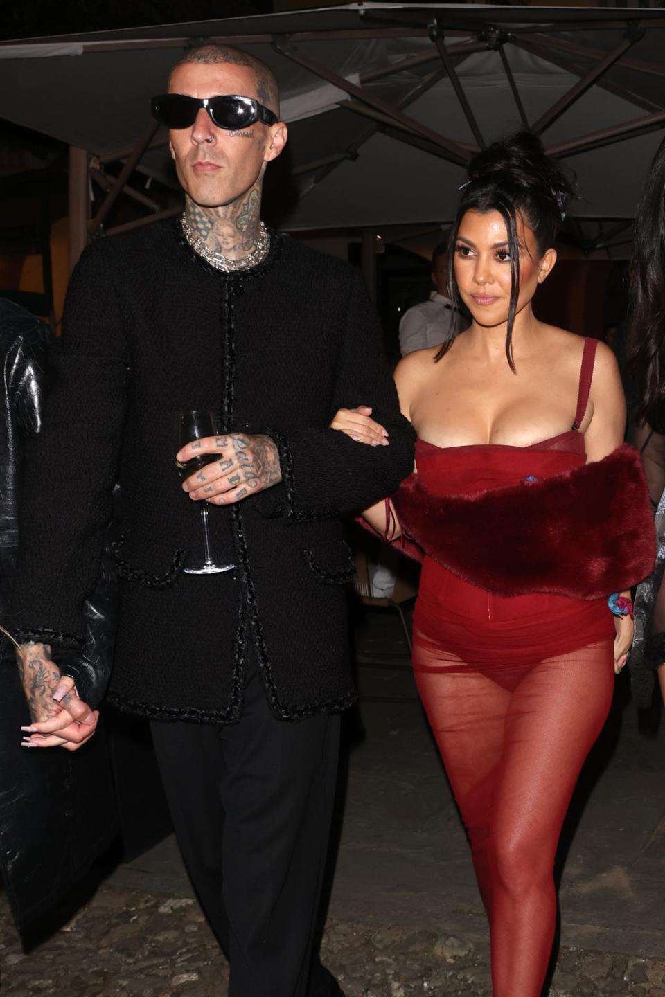 Kourtney Kardashian wore a red sheer dress (GC Images)