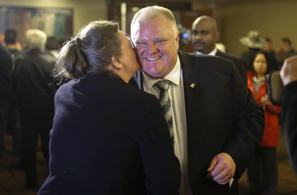 Toronto Mayor Rob Ford (R) greets a supporter at his campaign launch party in Toronto, April 17, 2014. The Toronto municipal election is set for October 2014.