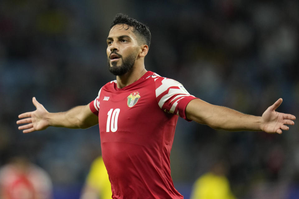 Jordan's Mousa Altamari celebrates after scoring his side's fourth goal during the Asian Cup Group E soccer match between Malaysia and Jordan at Al Janoub Stadium in Al Wakrah, Qatar, Monday, Jan. 15, 2024. (AP Photo/Aijaz Rahi)