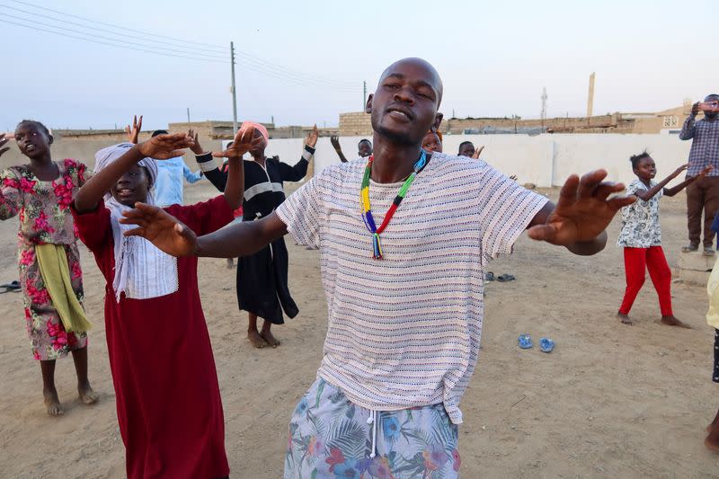 FILE PHOTO: General Kidi, a member of the Nuba Mountain Sound band, trains children to dance, in Port Sudan