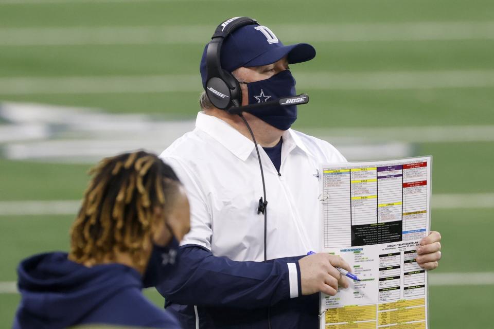 Dallas Cowboys head coach Mike McCarthy watches play against the Philadelphia Eagles in the first half of an NFL football game in Arlington, Texas, Sunday, Dec. 27. 2020. (AP Photo/Ron Jenkins)