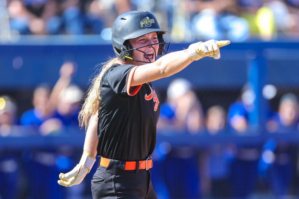 Coweta's Chaney Helton (3) celebrates after her teammate hits a RBI during the 5A high school softball state tournament championship game between Piedmont High School and Coweta High School at USA Softball Hall of Fame Complex in Oklahoma City on Saturday, Oct. 15, 2022.