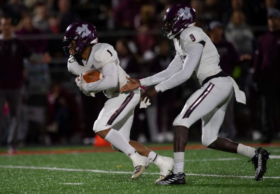 Mount Vernon’s Nicot Burnett (8) hands off to Mount Vernon’s Kortez Stewart (1) as the Mount Vernon Wildcats play the North Posey Vikings Friday evening, Oct. 7, 2022. 