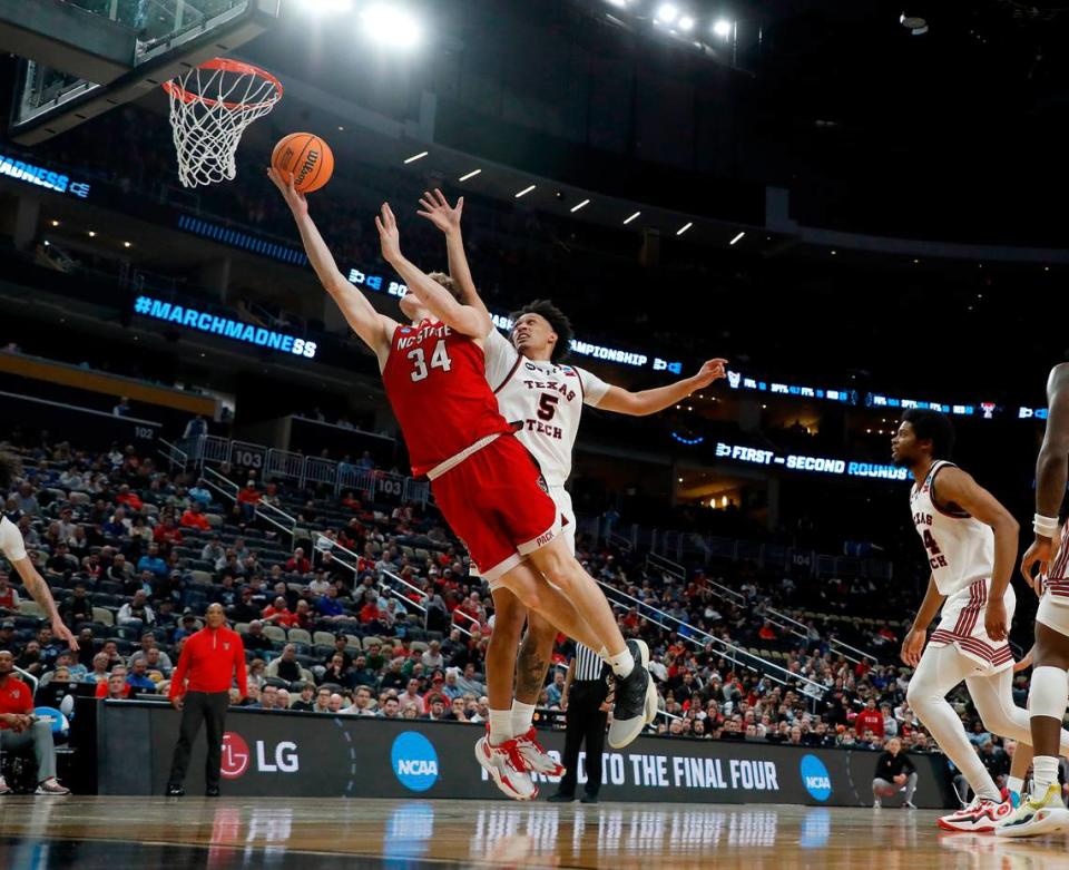 N.C. State’s Ben Middlebrooks gets past Texas Tech’s Darrion Williams to lay the ball in during the second half of the Wolfpack’s 80-67 win in the first round of the NCAA Tournament on Thursday, March 21, 2024, at PPG Paints Arena in Pittsburgh, Pa.