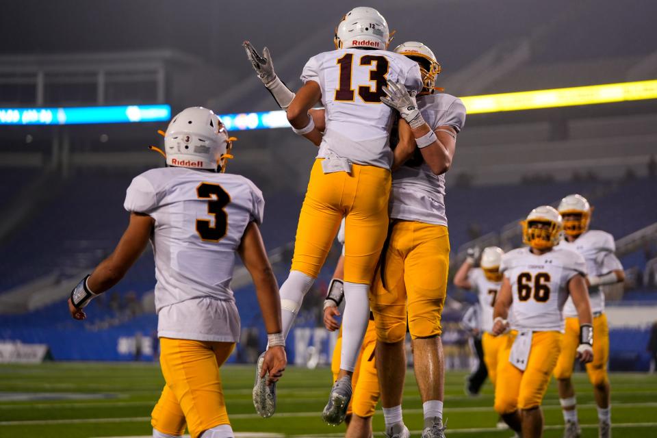 Cooper Jaguars wide receiver Isaiah Johnson (13) celebrates with teammates after scoring a touchdown during the KHSAA Class 5A 2023 UK HealthCare Sports Medicine state finals football game between Cooper Jaguars and Bowling Green Purples on Saturday, Dec. 2, 2023, at Kroger Field in Lexington, Ky.