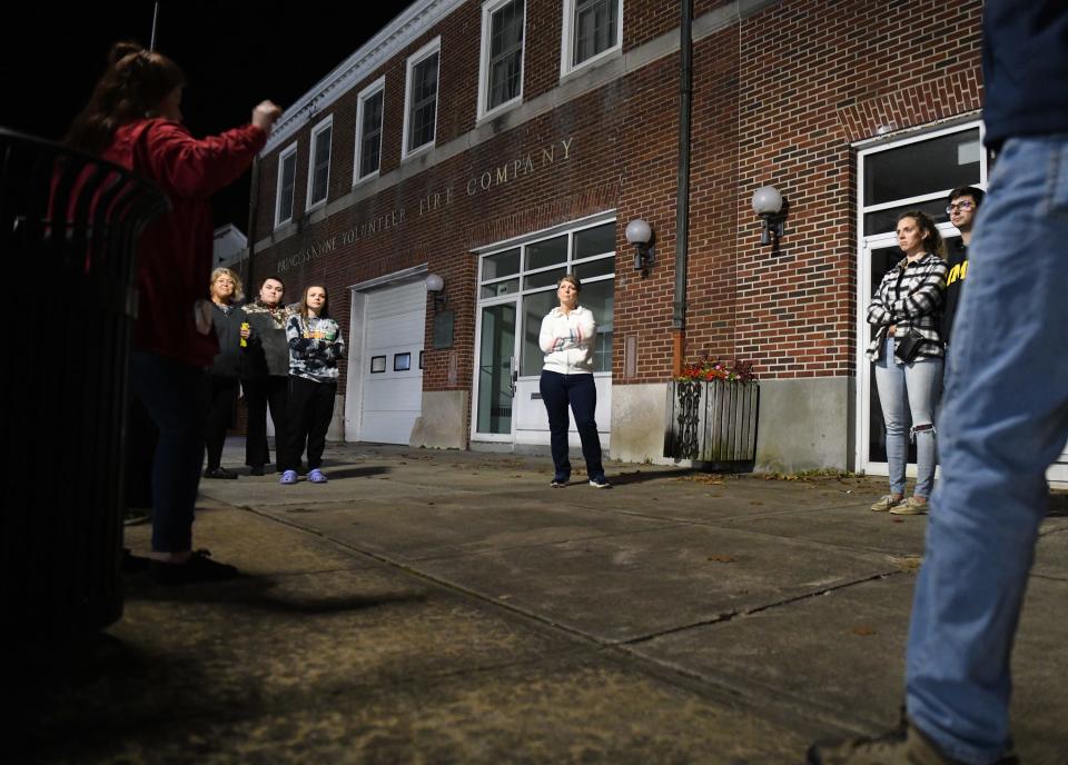 Chesapeake Ghost Tours guide Bre Bittner talks about the haunting at the volunteer fire company Oct. 20, 2023, in Princess Anne, Maryland.