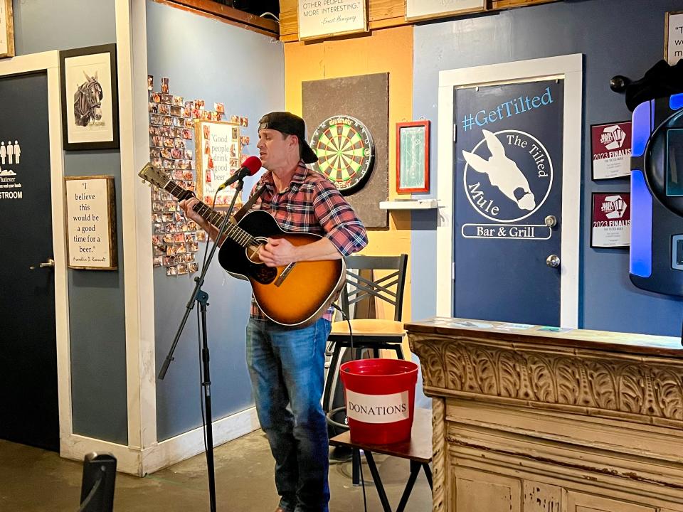 Rett Stockstill performs at the monthly Stop 22 veterans open mic at The Tilted Mule in Columbia, which is approaching its first-year anniversary in April.