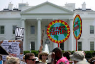 <p>Protesters carry signs during the Peoples Climate March at the White House in Washington, April 29, 2017. (Joshua Roberts/Reuters) </p>