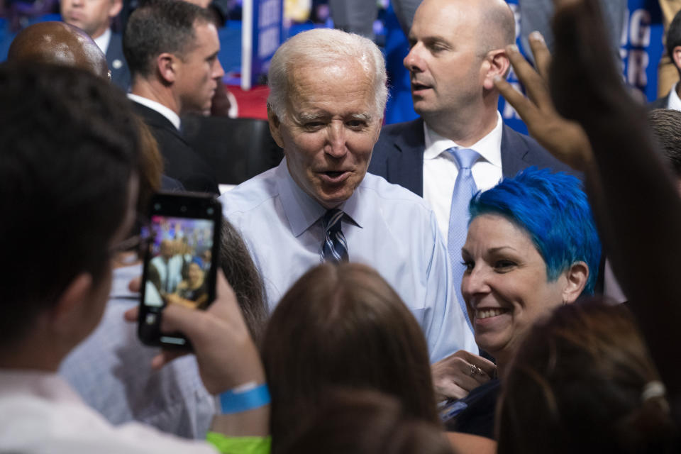 President Joe Biden greets supporters during a rally for the Democratic National Committee at Richard Montgomery High School, Thursday, Aug. 25, 2022, in Rockville, Md. (AP Photo/Alex Brandon)