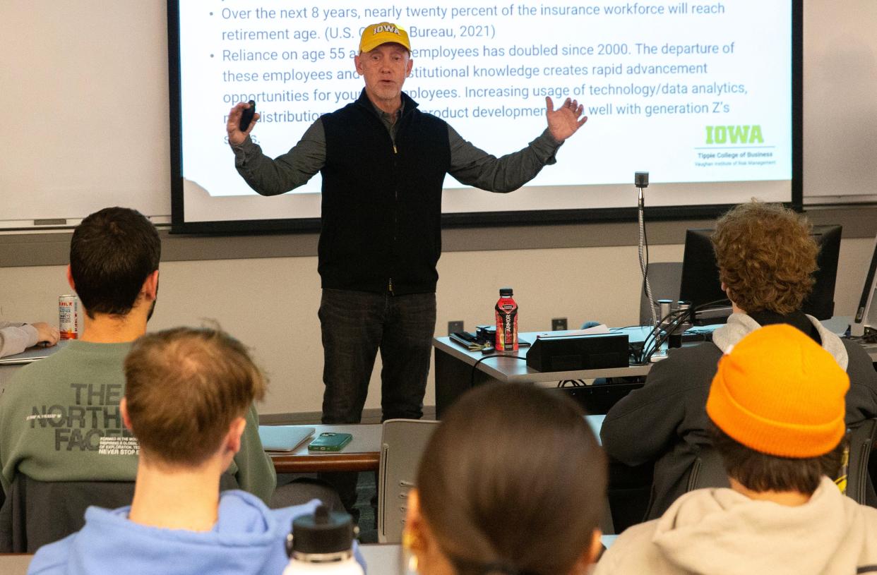 Jim Lewis, director of the Vaughan Institute of Risk Management and Insurance, speaks to a Principles of Risk Management class, part of a revived, insurance-oriented major at the University of Iowa.