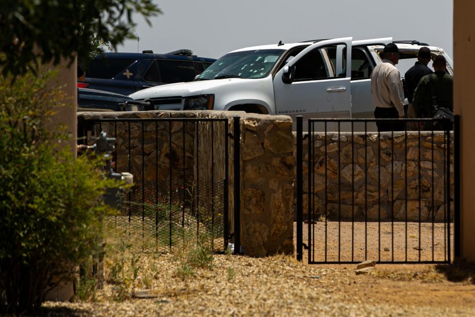 A white Chevy Suburban riddled with bullets sits on Arroyo Road on June 21, 2023. Police closed the area off.