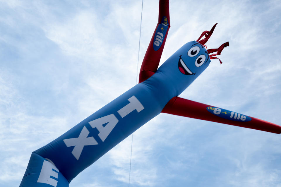 CHICAGO, ILLINOIS - APRIL 15: An inflatable advertising signs, dances outside of a tax preparer's office on April 15, 2024 in Chicago, Illinois. Today is the deadline for filing federal income taxes in the United States.  (Photo by Scott Olson/Getty Images)