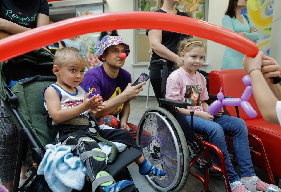 Ukrainian children, currently admitted at the Ohmatdyt Hospital, attend a party organized for them in Kyiv, Ukraine (EPA)