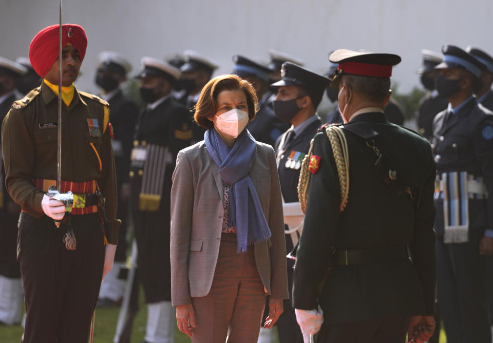 French defense minister Florence Parly inspects a joint military guard of honour upon her arrival in New Delhi, India, Friday, Dec. 17, 2021. (AP Photo/Manish Swarup)