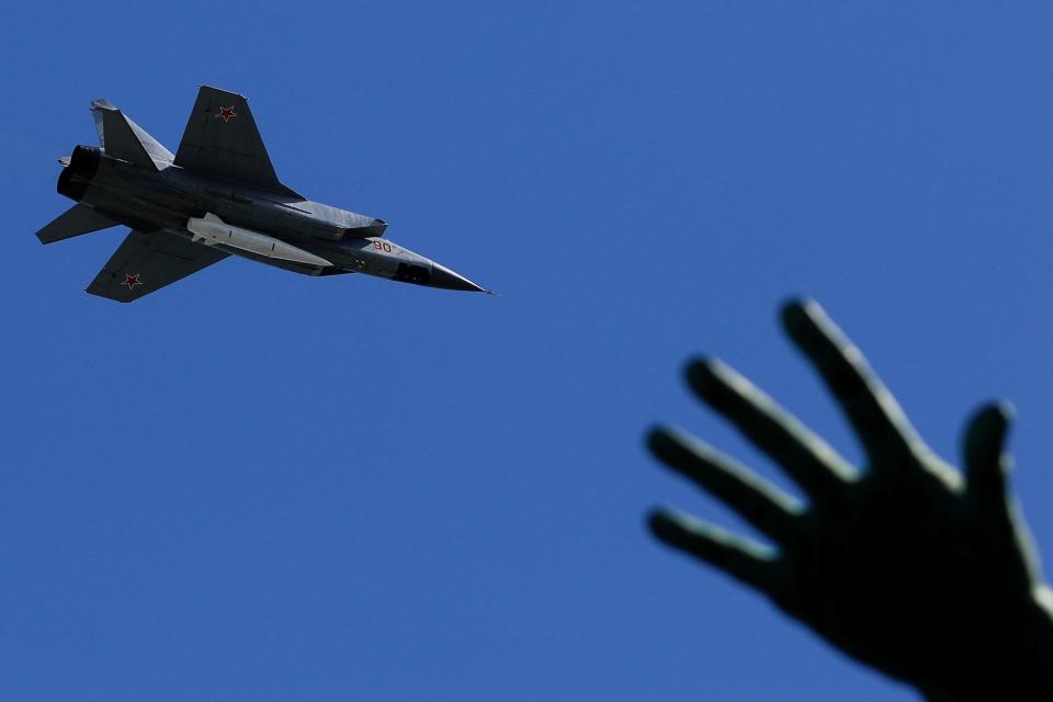 Mikoyan MiG-31K fighter jets with Kinzhal hypersonic missiles fly over Moscow's Red Square during the Victory Day military parade.