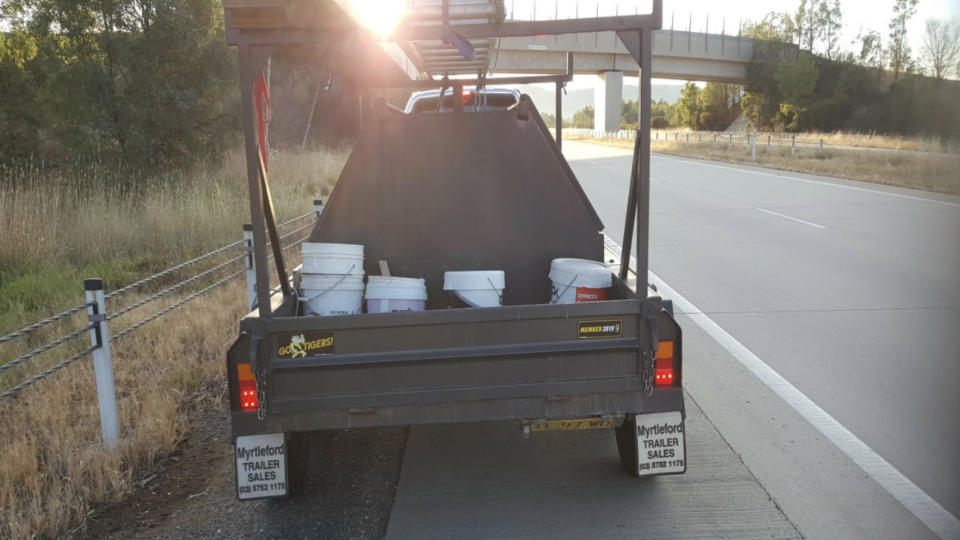 Numbers plates are not allowed to be hinged. Source: NSW/ Traffic and Highway Patrol Command