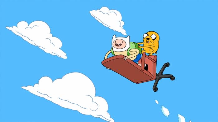 Finn the human rides on an office chair in the sky, with Jake the Dog holding onto him