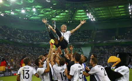 Football Soccer - Germany v Finland - Soccer Friendly - Moenchengladbach, Germany - 31/08/16. Germany's Bastian Schweinsteiger gets honoured after the match. REUTERS/Wolfgang Rattay