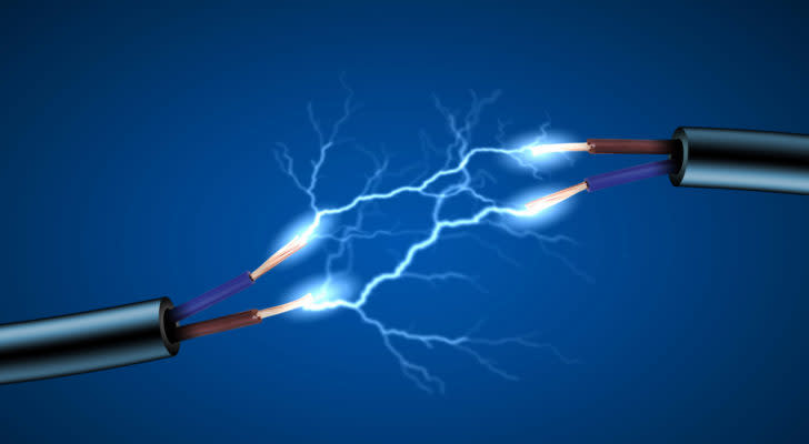 A concept image of electricity flowing between two disconnected electric cables.