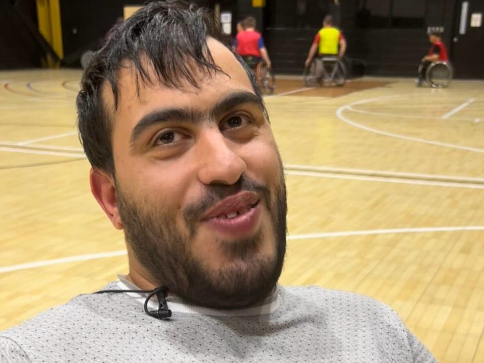 Mohammed Nadi is calling on big videogame companies like 2K or EA Sports to create a wheelchair basketball videogame.  (Jacob Barker/CBC - image credit)