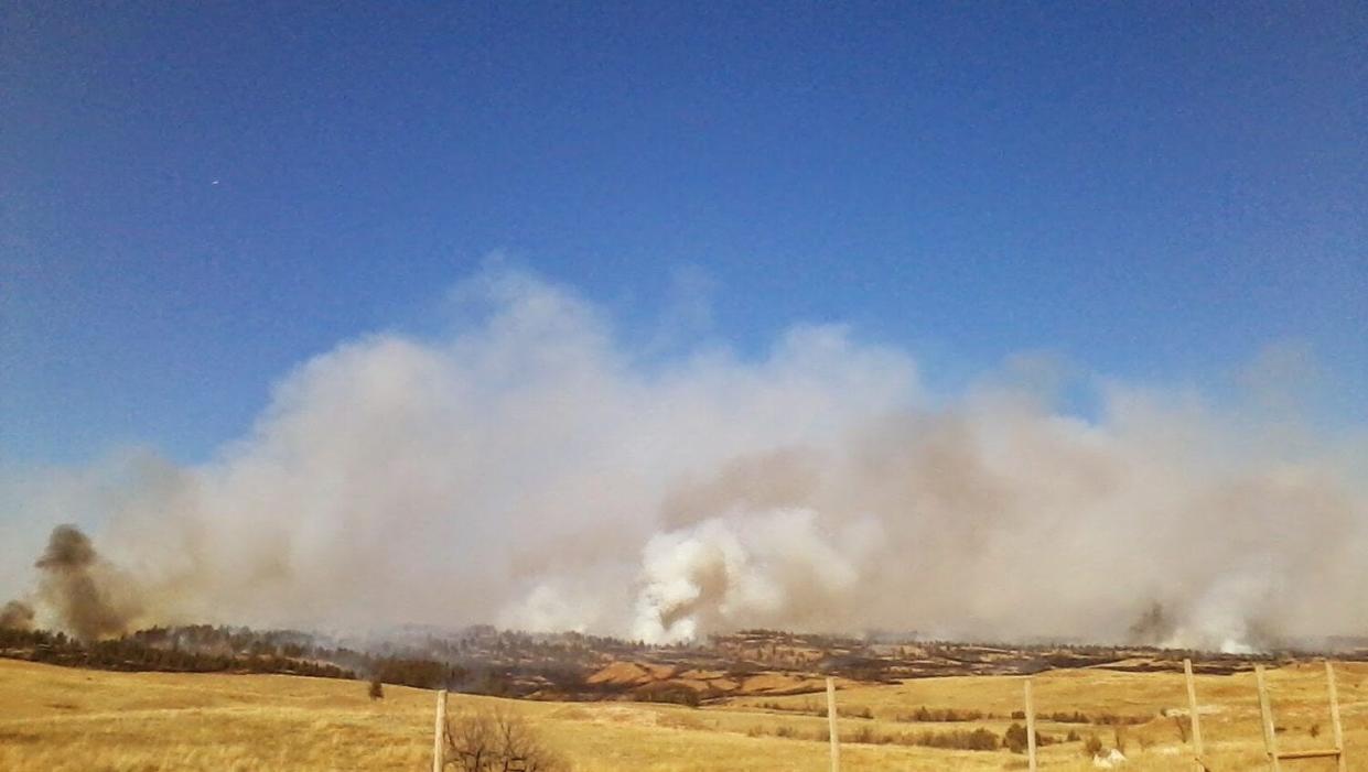 Smoke rises from a controlled burn that escaped and became a wildfire in 2015 at Wind Cave National Park.