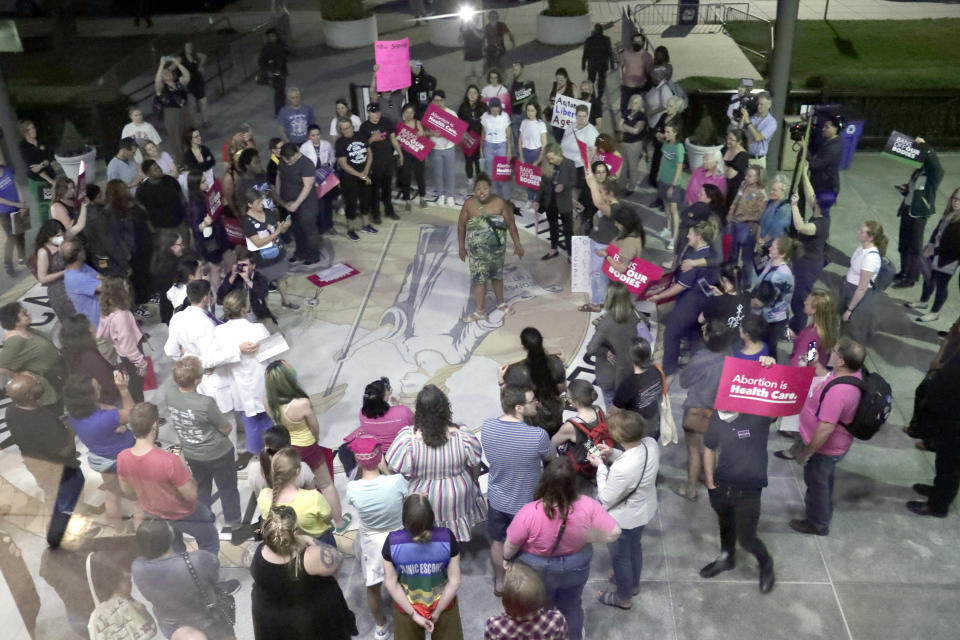 Abortion rights protesters gather outside the building, Tuesday, May 16, 2023, in Raleigh, N.C., after North Carolina House members voted to override Democratic Gov. Roy Cooper's veto of a bill that would change the state's ban on nearly all abortions from those after 20 weeks of pregnancy to those after 12 weeks of pregnancy. Both the Senate and House had to complete successful override votes for the measure to be enacted into law. The Senate voted to override the veto earlier and the House also voted to override. (AP Photo/Chris Seward)