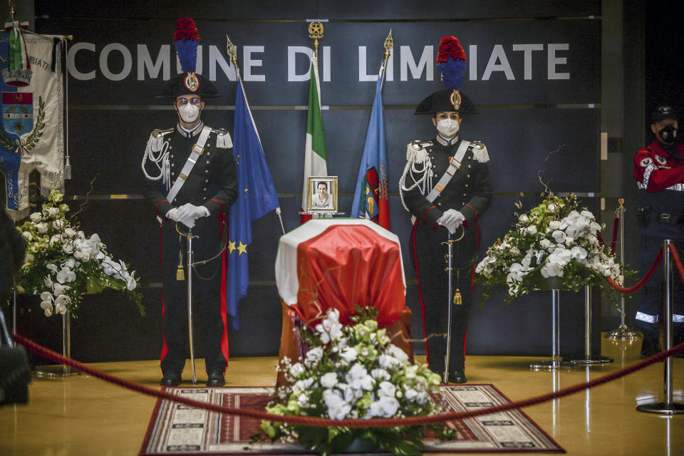 Carabinieri officers stand by the coffin of Italian ambassador to the Democratic Republic of Congo Luca Attanasio, in Limbiate, near Milan, Italy, Friday, Feb. 26, 2021. Italy paid tribute to its ambassador to Congo and his bodyguard who were killed in an attack on a U.N. convoy, honoring them with a state funeral Thursday. (Claudio Furlan/LaPresse via AP)