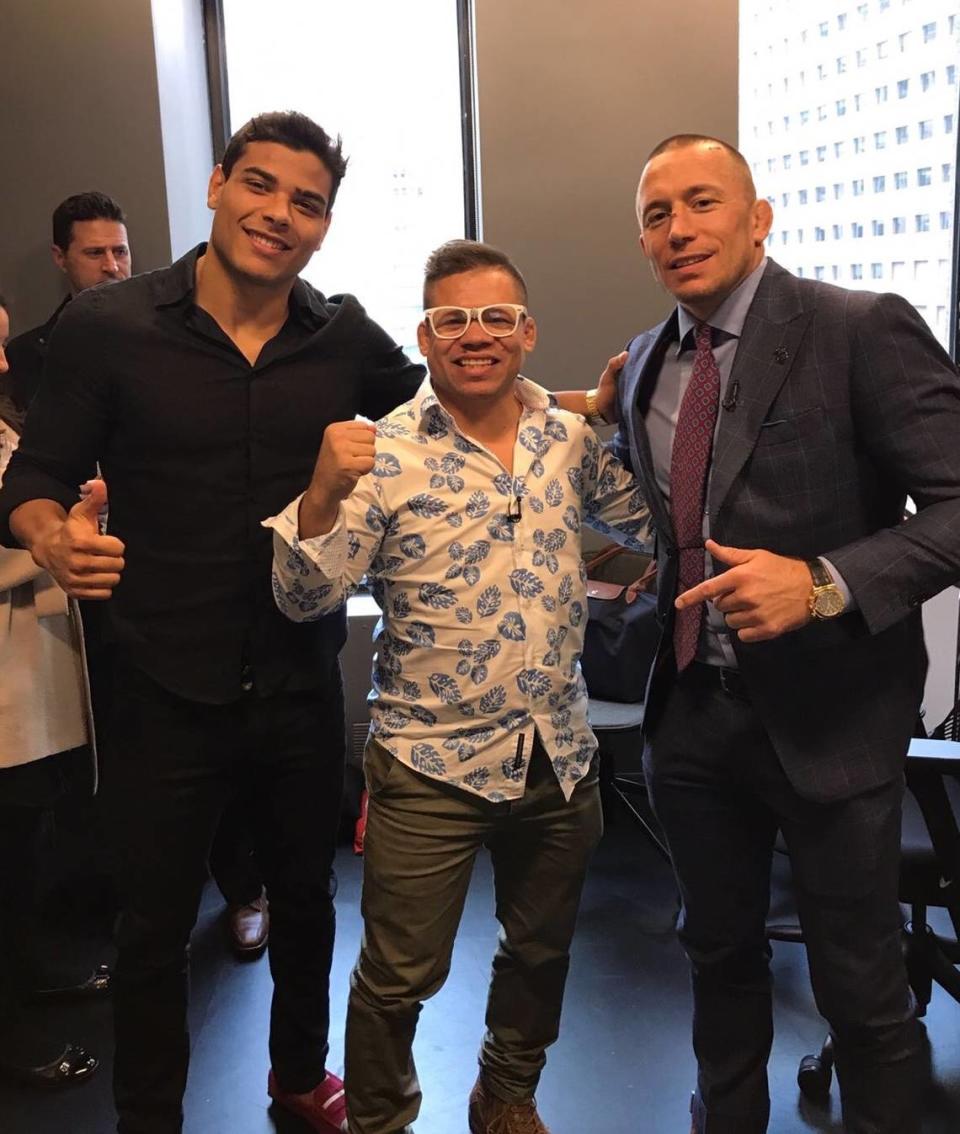 UFC fighter Paulo Costa (left) with Coach Eric Albarracin and his signature white glasses.