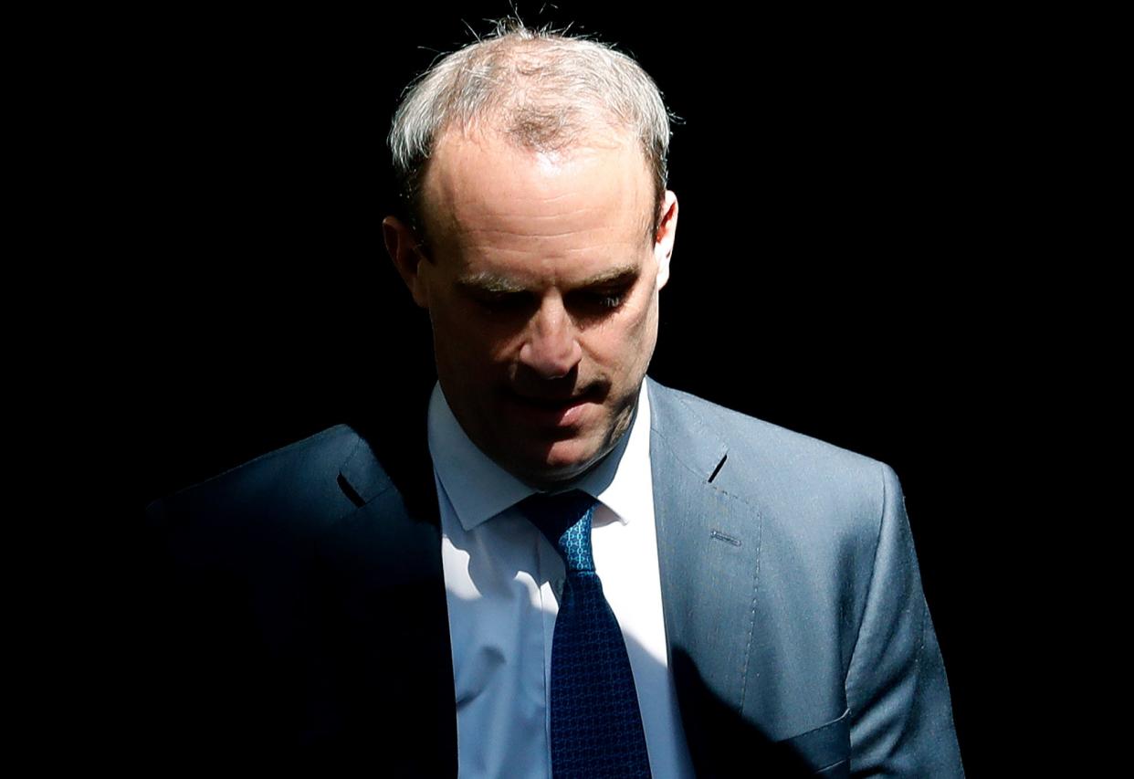 Raab leaving Downing Street in April 2020 (File photo) (AP)