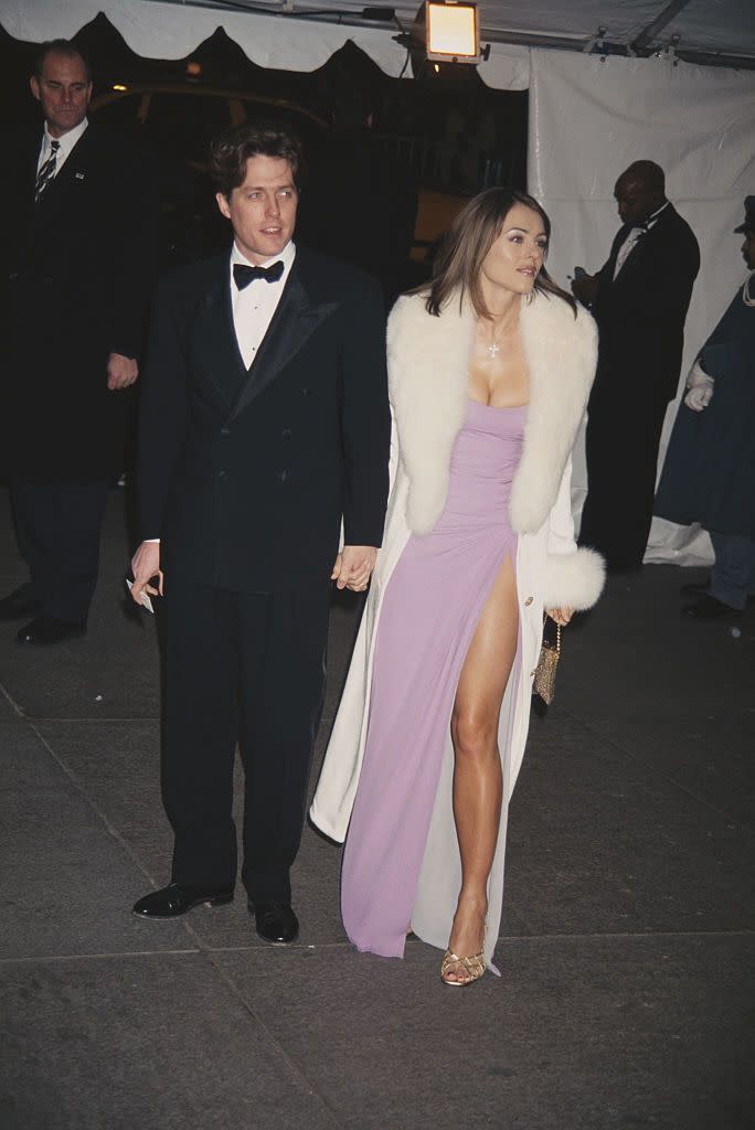 <p>For her first Met Gala, Elizabeth showed up on the arm of Hugh wearing a pink Versace dress. The theme that year was "Haute Couture." </p>