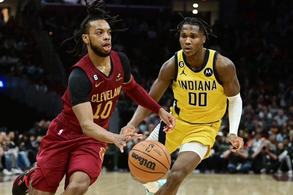 Apr 2, 2023; Cleveland, Ohio, USA; Cleveland Cavaliers guard Darius Garland (10) drives to the basket against Indiana Pacers guard Bennedict Mathurin (00) during the second half at Rocket Mortgage FieldHouse. Mandatory Credit: Ken Blaze-USA TODAY Sports