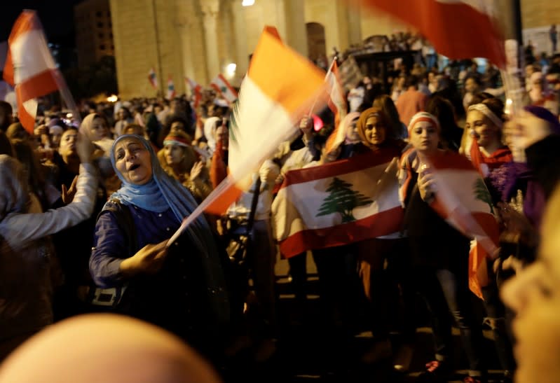 Protesters sing at a demonstration during ongoing anti-government protests in Beirut